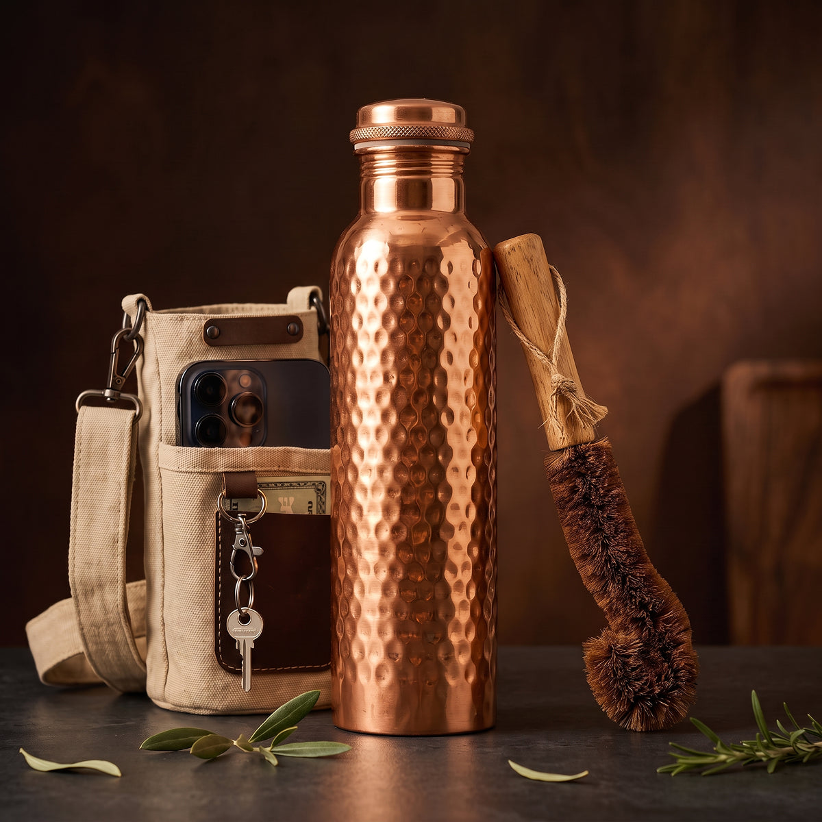Neera Essentials Set: hammered copper water bottle, canvas travel sleeve with phone pocket and coir care brush