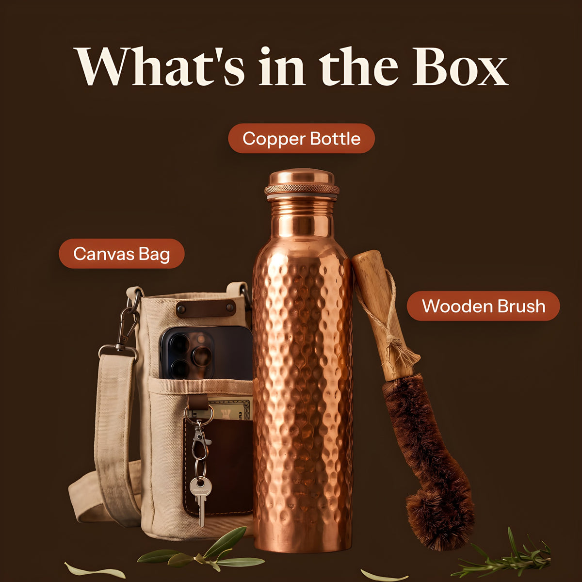 What's in the box: hammered copper water bottle, canvas bag with phone pocket and wooden coir cleaning brush